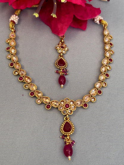 Intricate Gold, Ruby and AD Necklace Set with Mang Tika