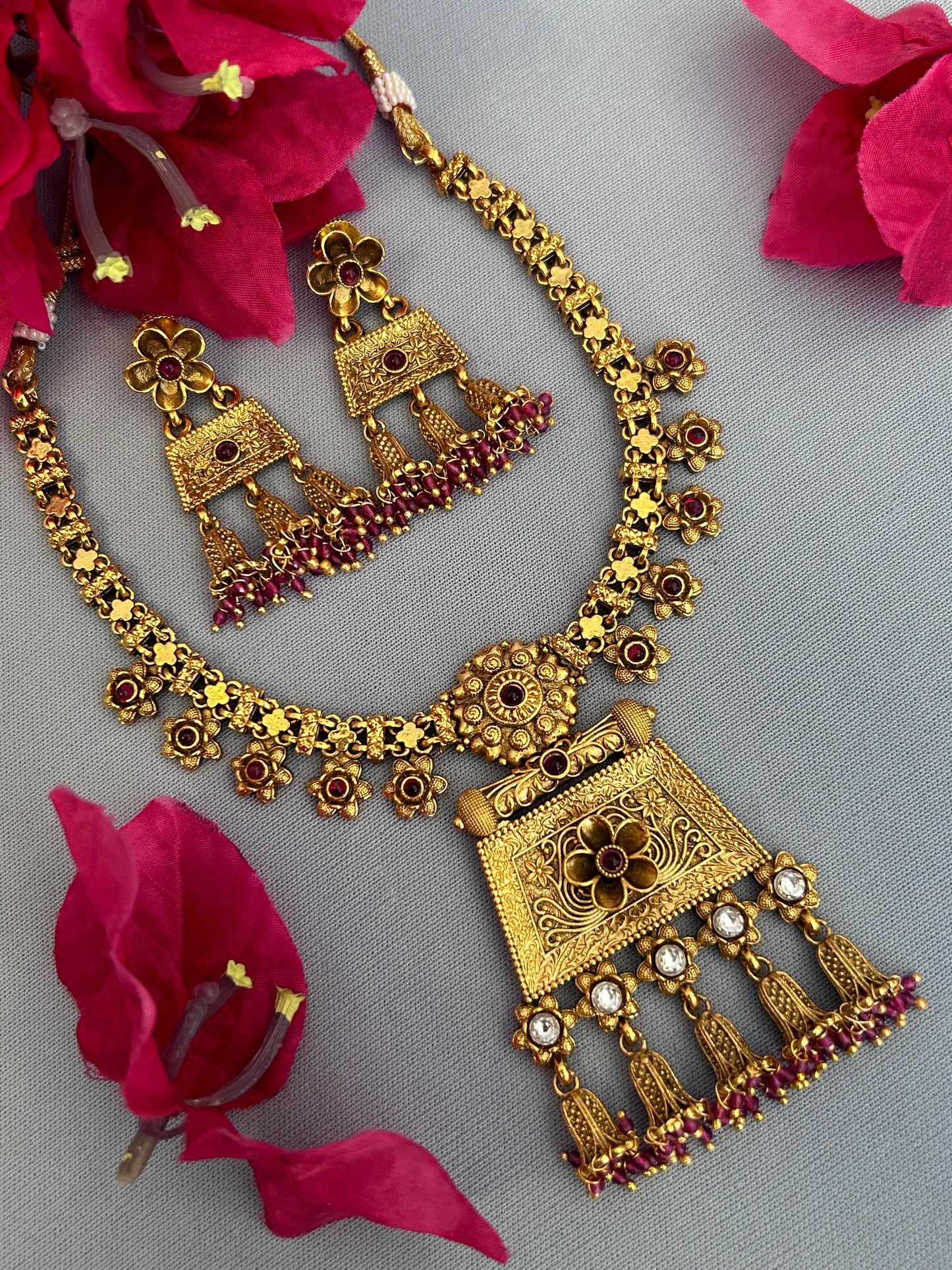 Gold Designer Necklace Set with Ruby Beaded Flower Bulbs Locket