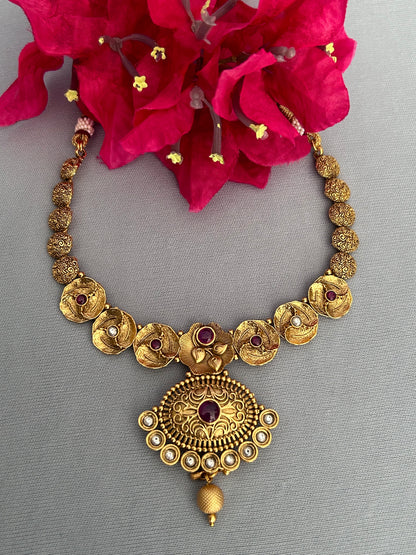 Quirky Antique Gold Necklace with Magnificent Locket and Cute Jhumkas