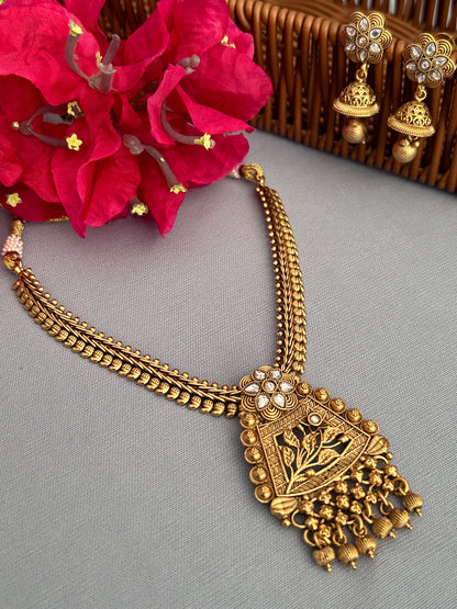 Antique Gold Necklace with Diamond Studded Locket and Intricate Jhumkas